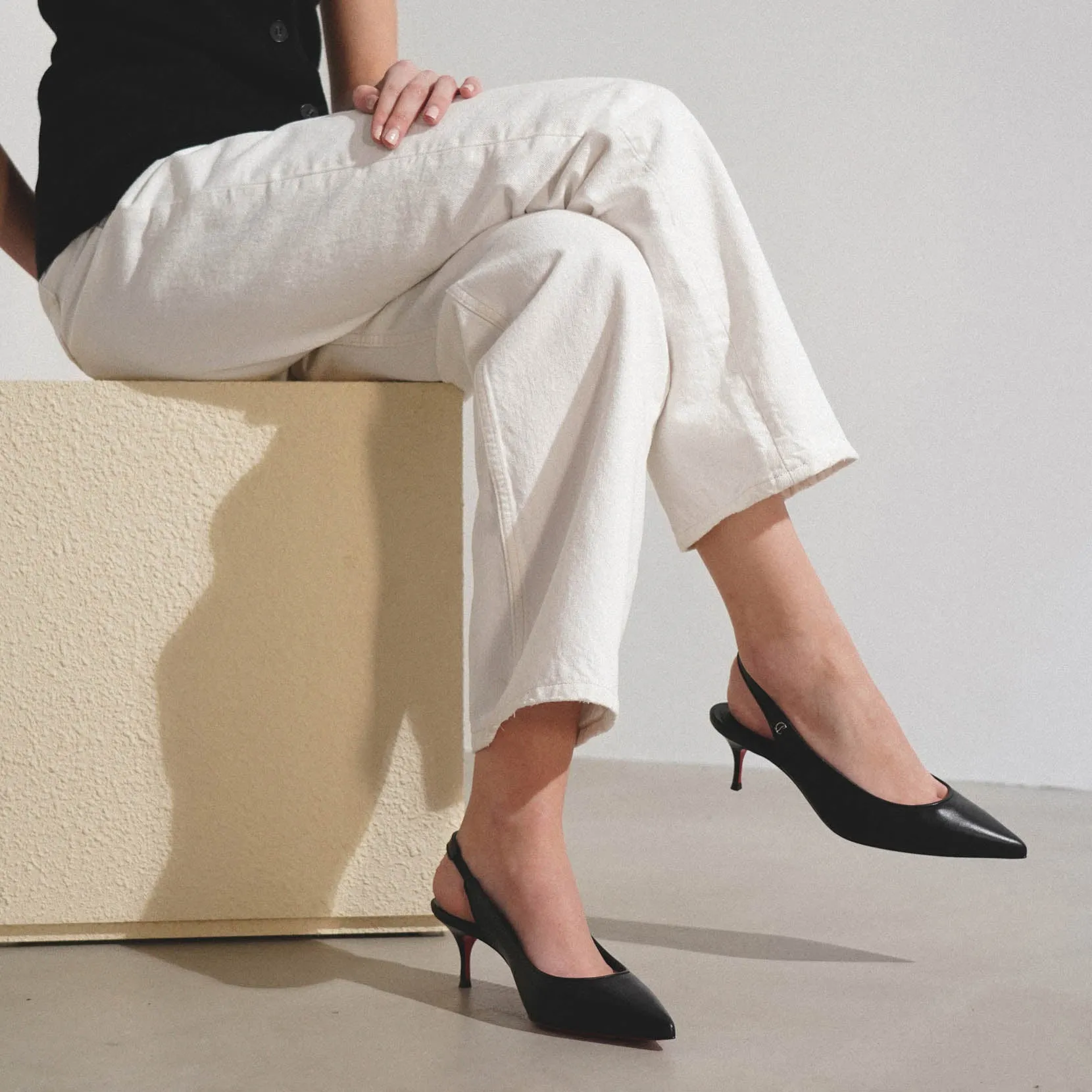 Sporty Kate 55 black leather slingbacks
